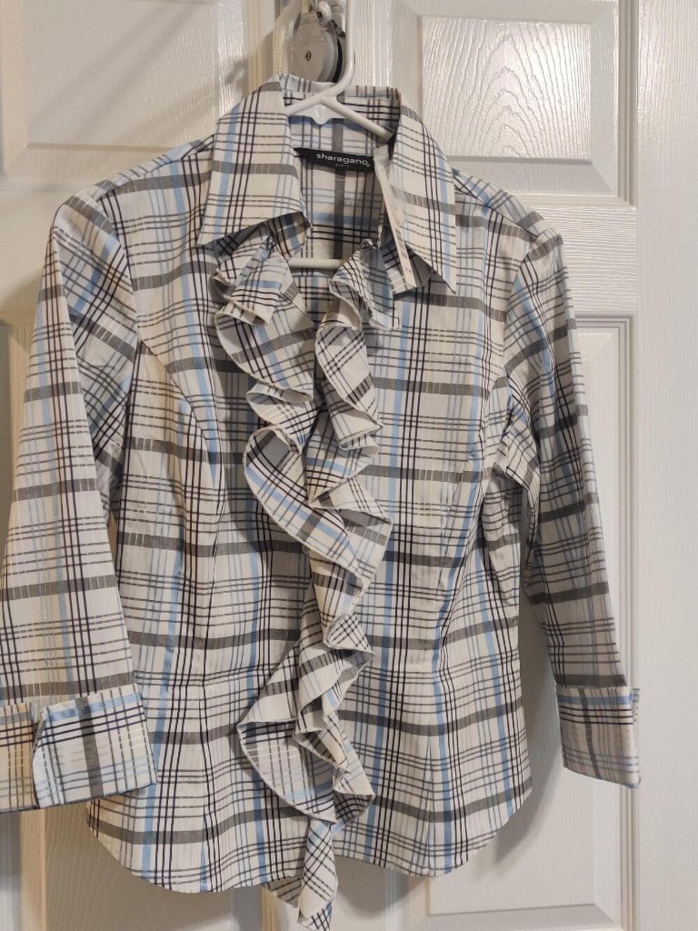 Plaid blouse with spandex for stretch.